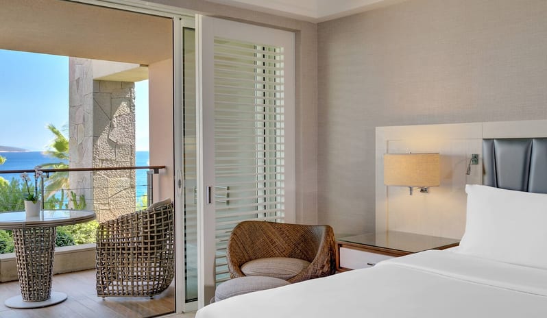 CARESSE HOTEL - ONE BEDROOM SUITE BEDROOM